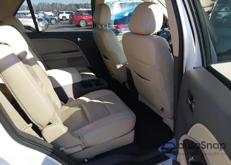 2009 Ford Taurus X Limited из США, поврежденный, VIN 1FMDK06W49GA03717